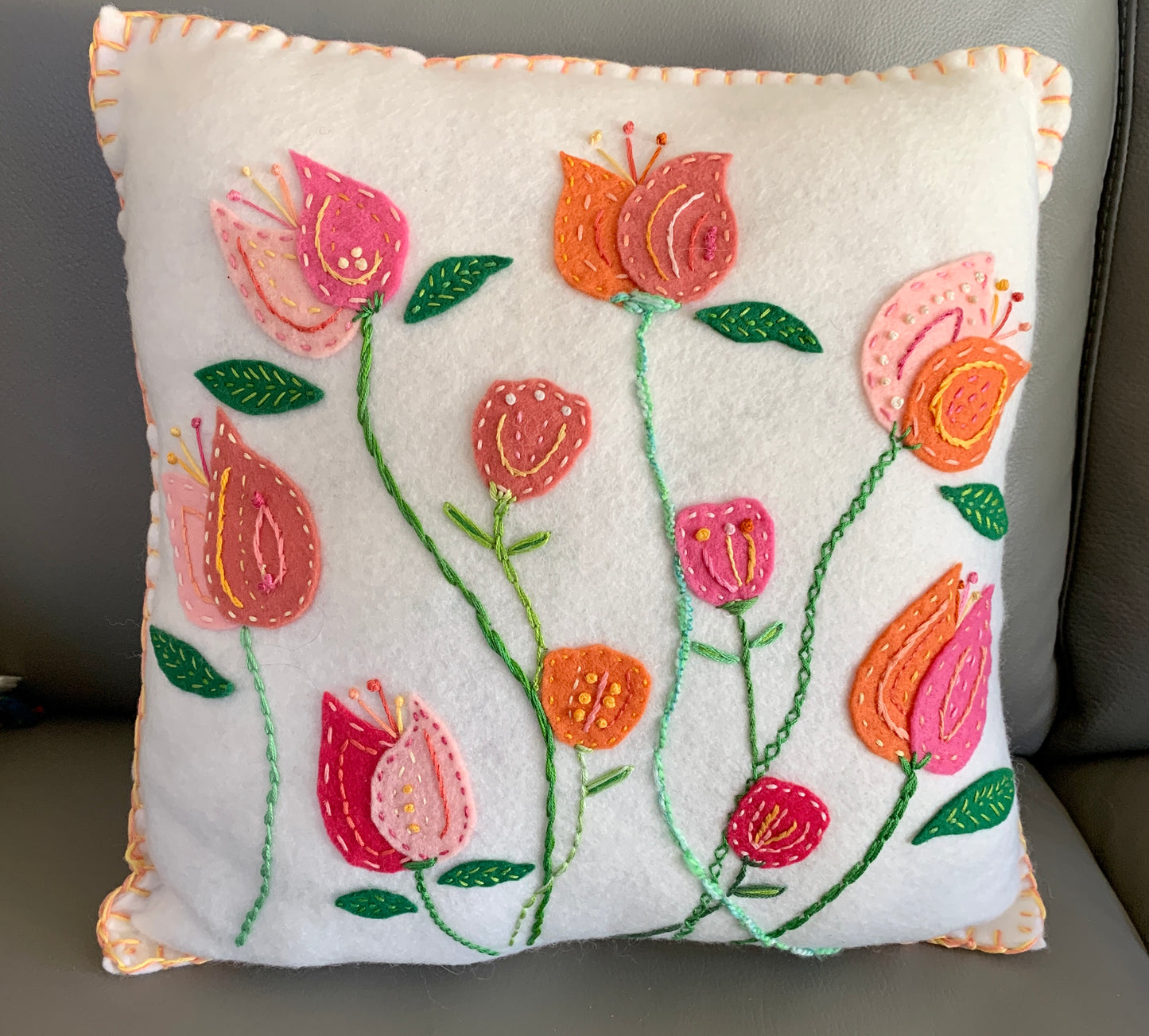 Wool felt pillow with orange and pink tulips